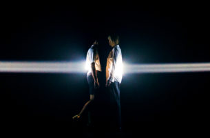 Frontera performance, dancers in front of columns of light